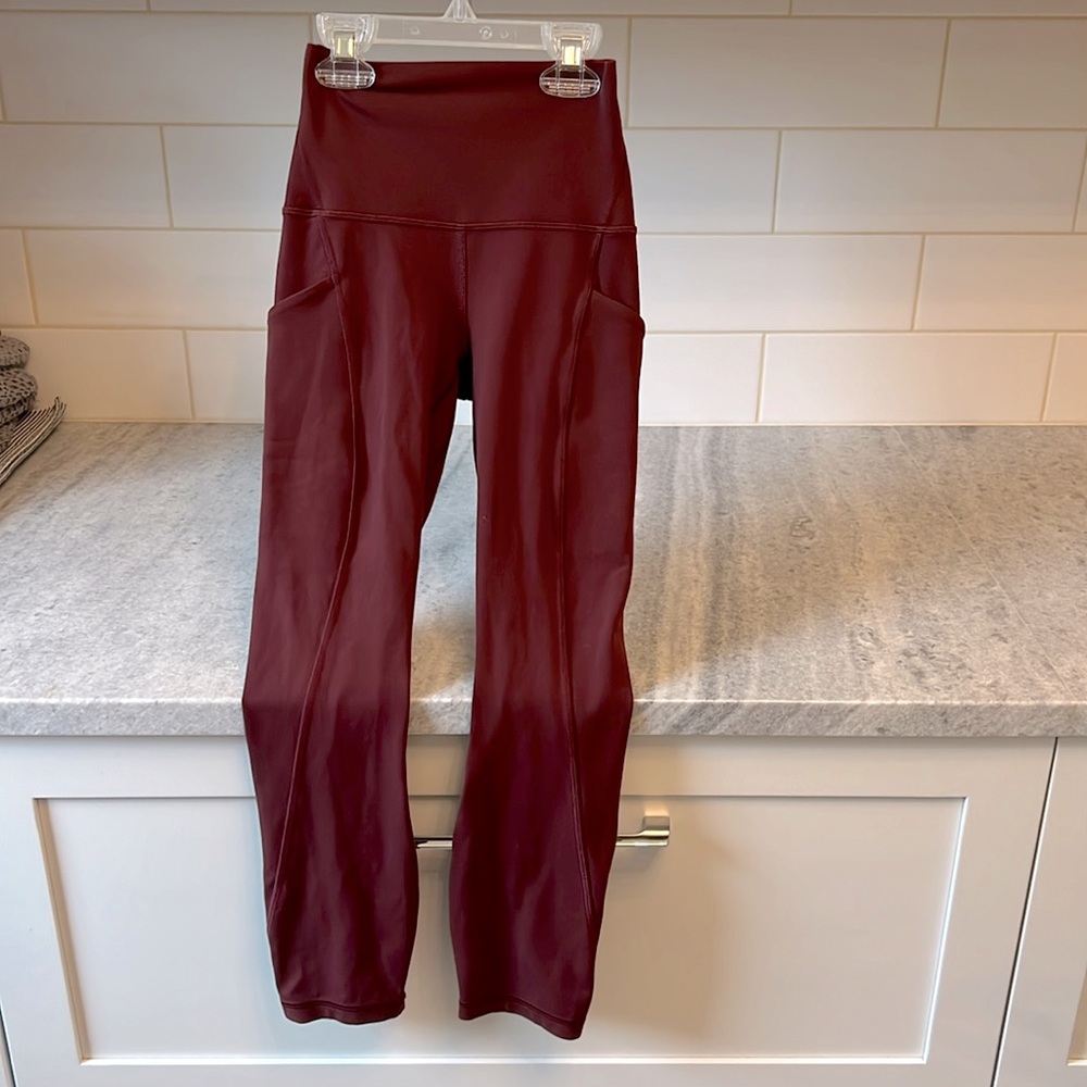 Lululemon Align high rise cropped 23 size 0 with pockets 
color Merlot
Aggie